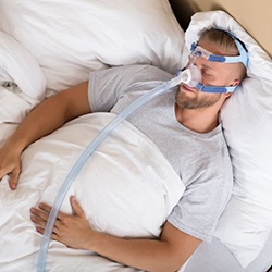 Man sleeping while using CPAP