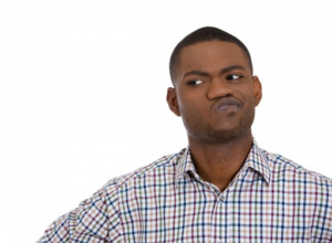 Man looking off to the side, wondering if his dental stains are genetic 